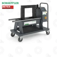 Industrial heat press mounted on a mobile wheeled cart with a right-side control panel; logos for Schaeffler and Betex visible.