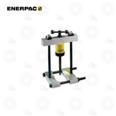 Manual hydraulic bearing press with two vertical posts and a crossbar on a metal base, used in workshops/repair shops.