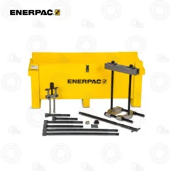 Enerpac yellow hydraulic workshop press with assorted rods and attachments laid out in front